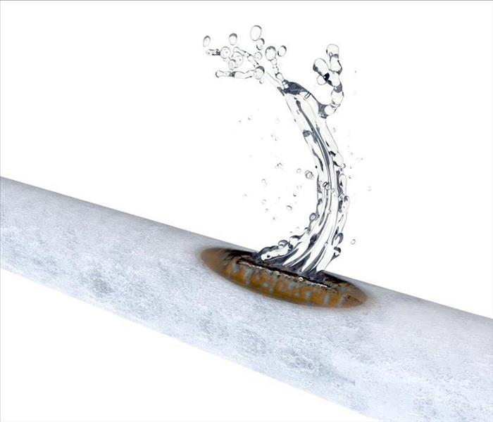Image of a frozen pipe leaking water after bursting